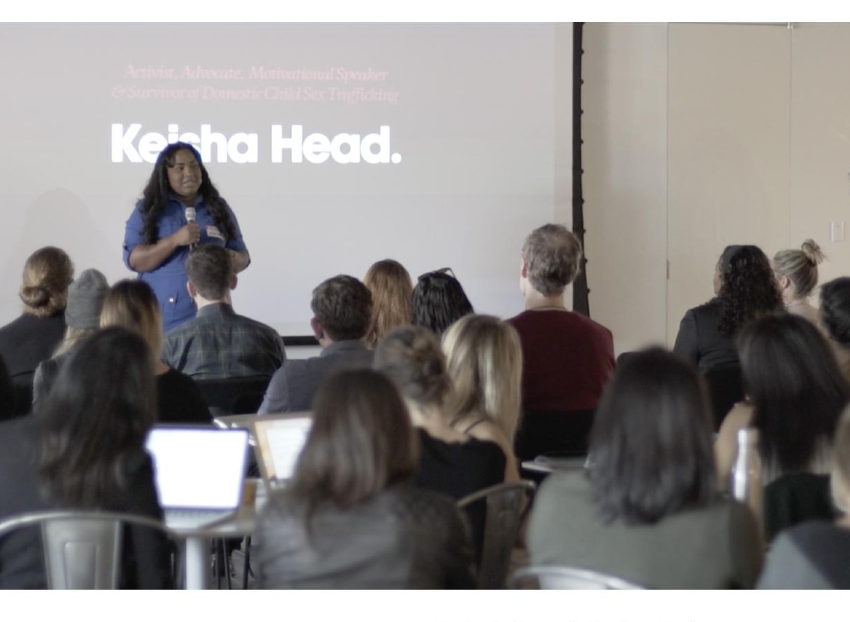 Keisha Head, activist, advocate, motivational speaker, and survivor of domestic child sex trafficking, addressing a Huge audience as a keynote speaker.